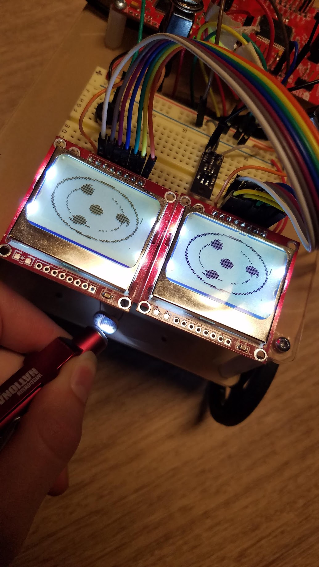 small robot with sharingan eyes